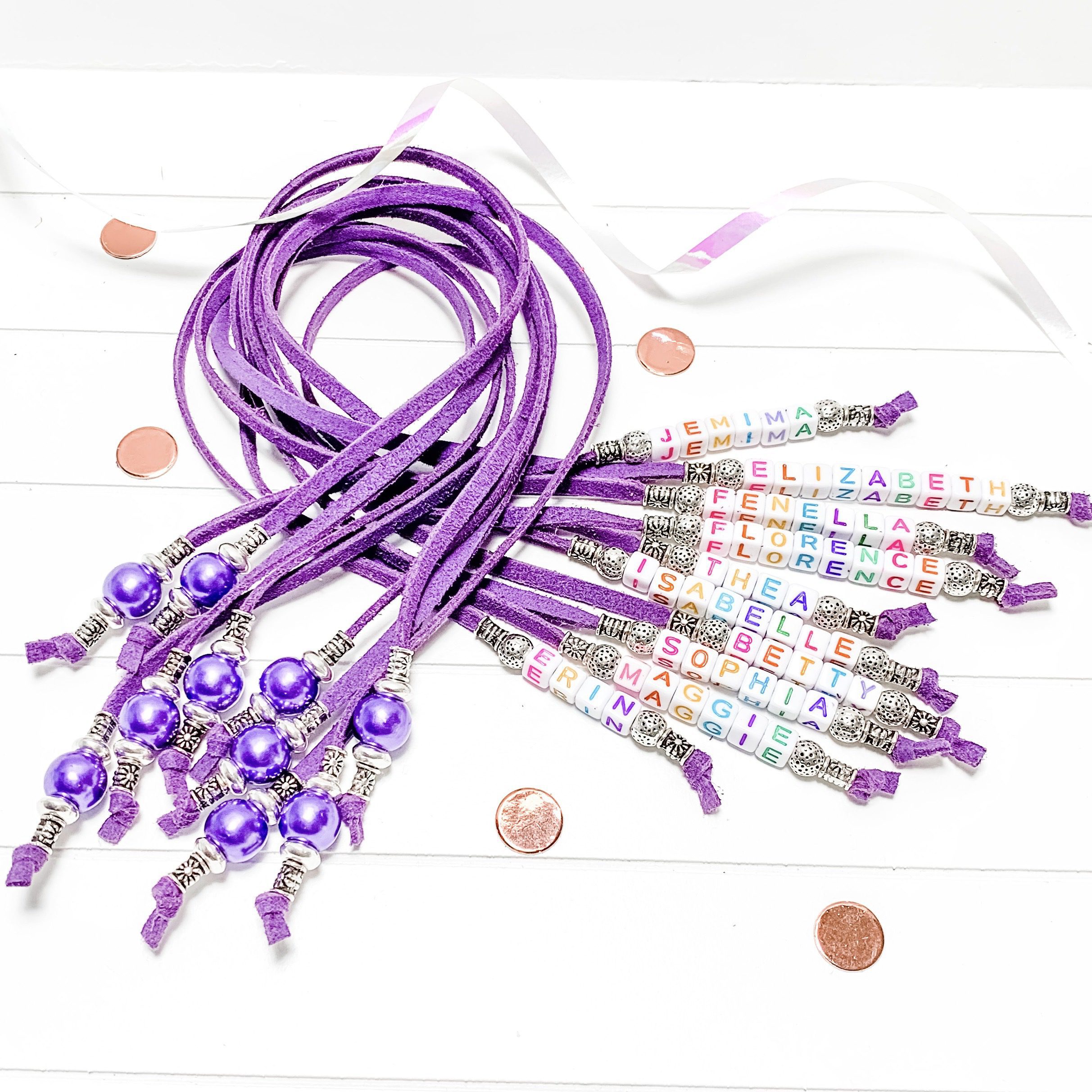 Personalised Bookmark Kit A bundle of purple personalised suede cord bookmarks