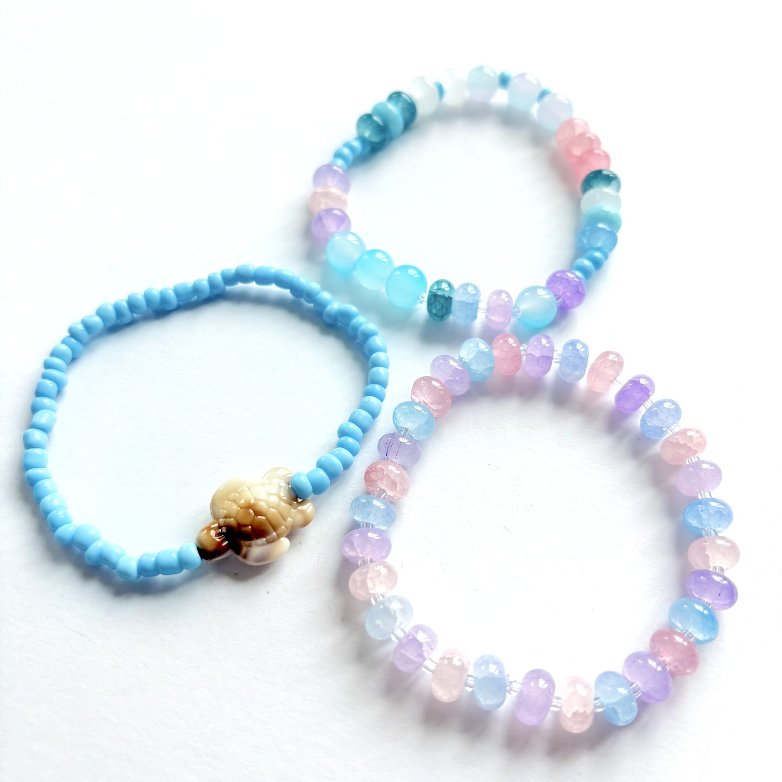 Sea Creatures an ocean themed jewellery set with a necklace and three bracelets in pink, blue and purple colours