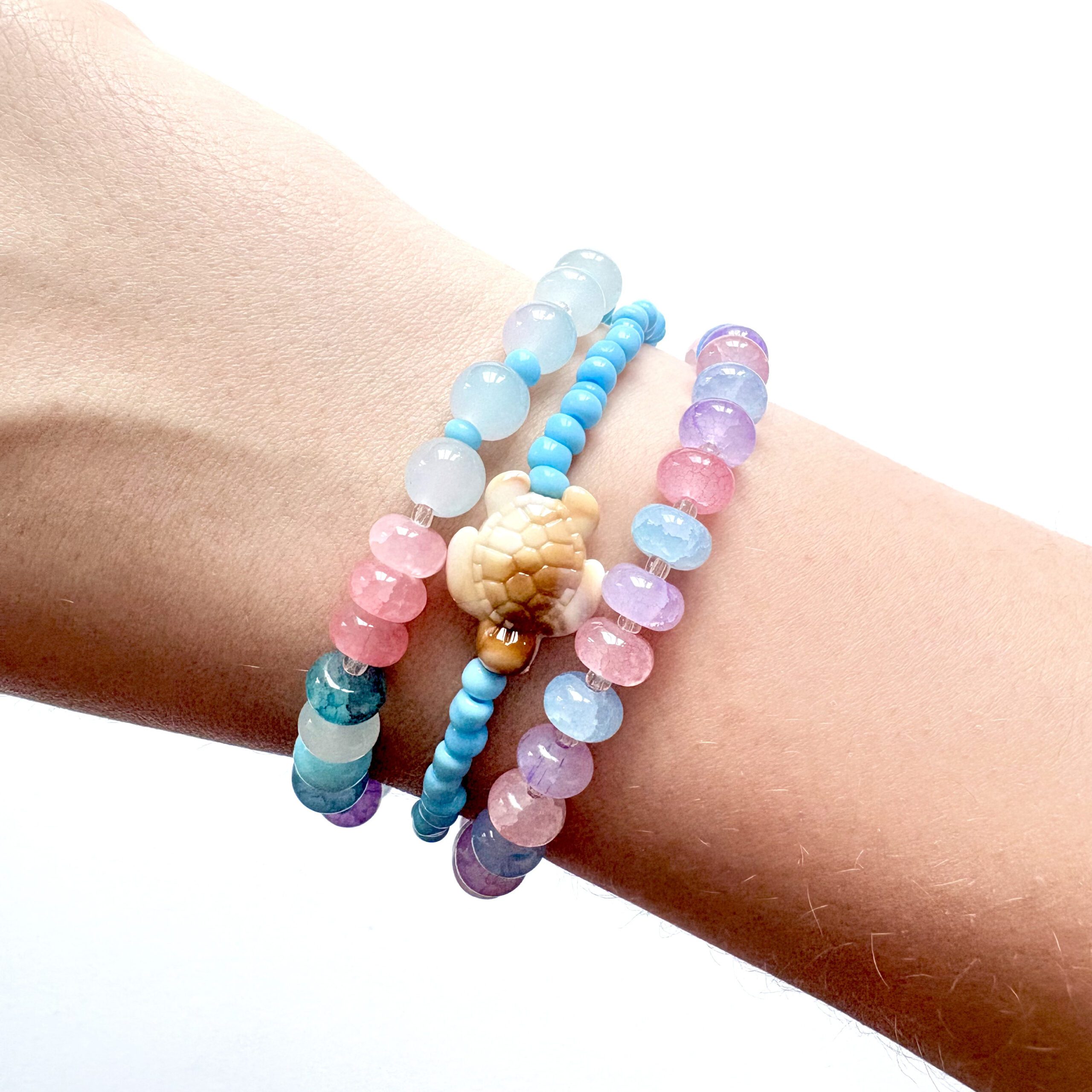 Sea Creatures an ocean themed jewellery set with a necklace and three bracelets in pink, blue and purple colours