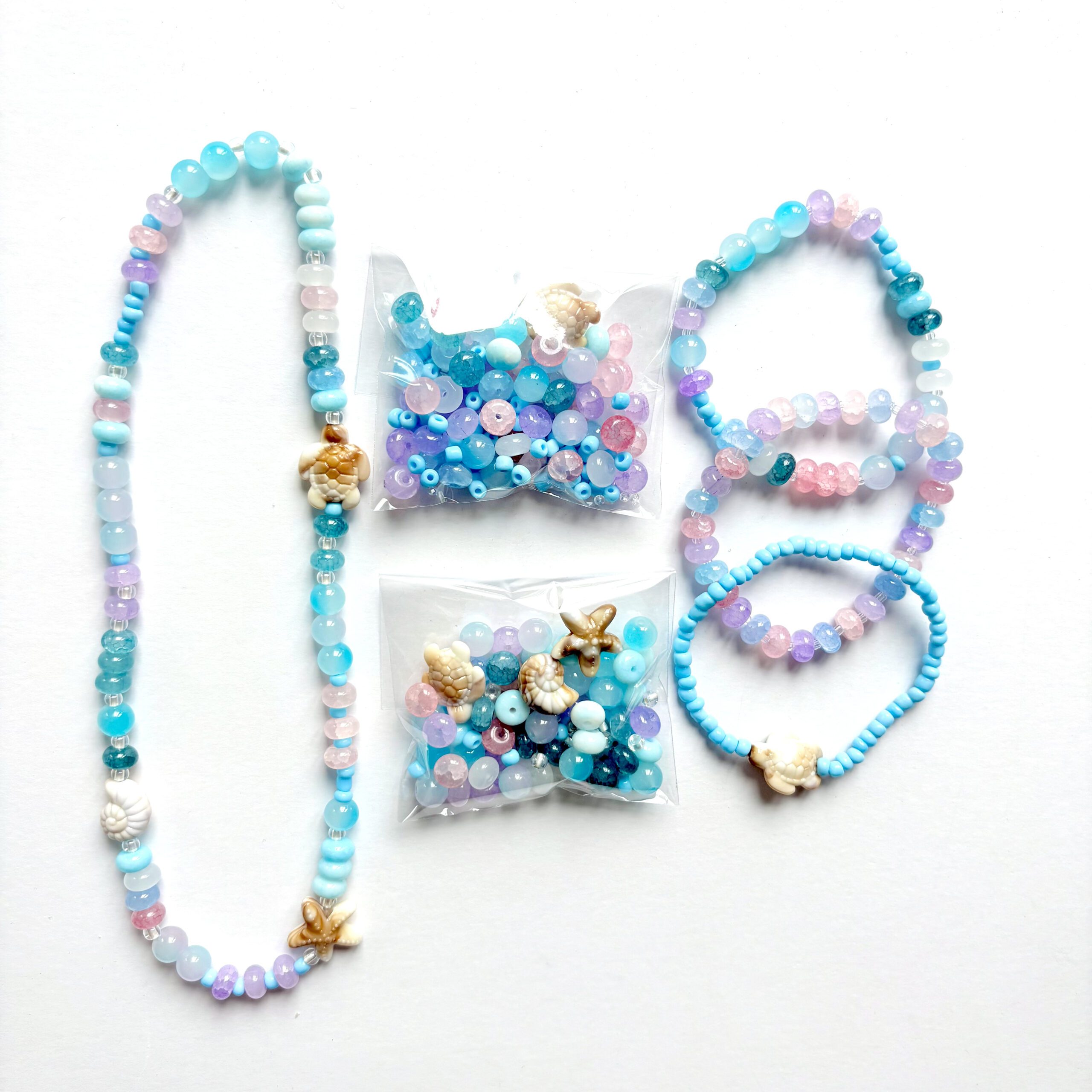 Sea Creatures an ocean themed jewellery set with a necklace and three bracelets in pink, blue and purple colours