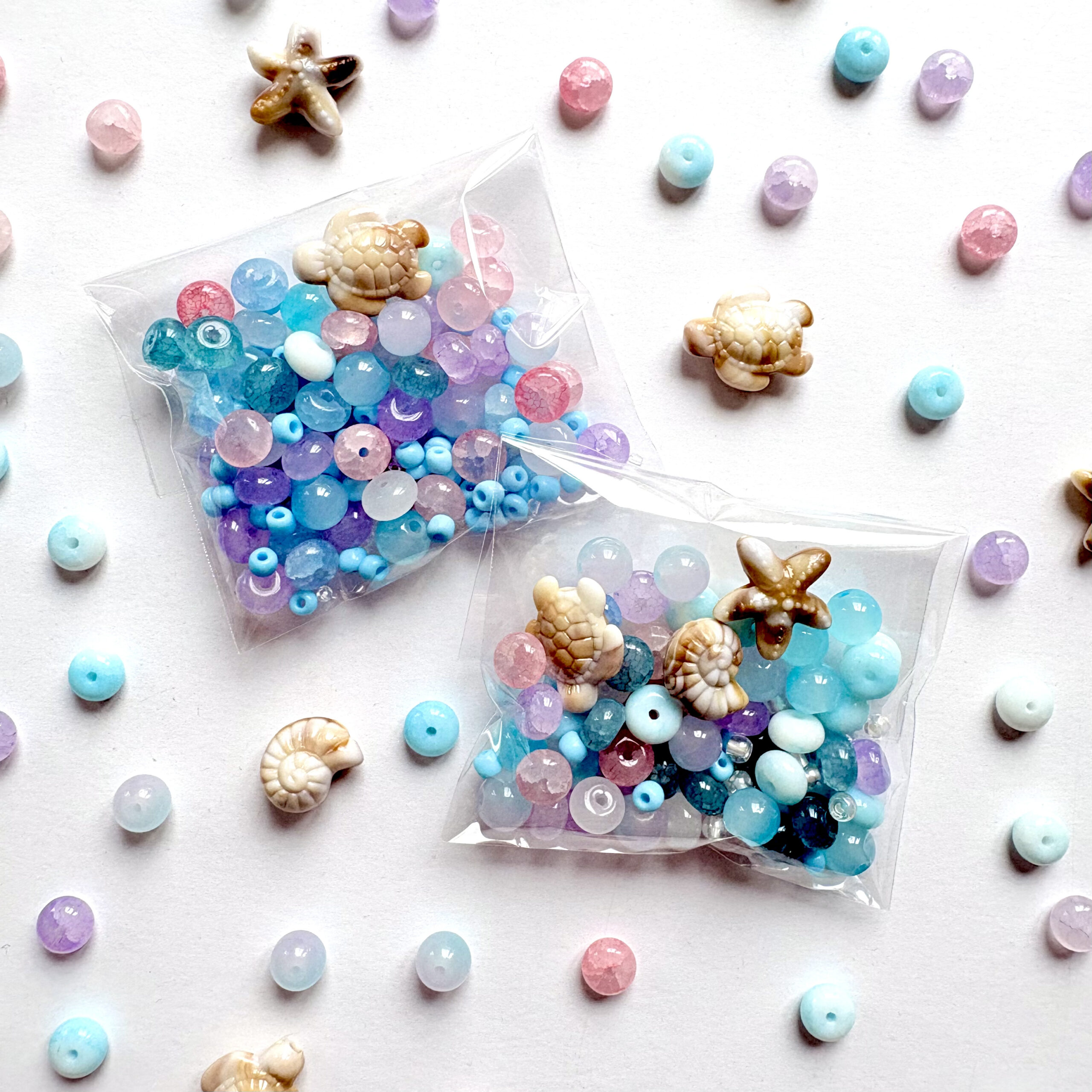 Sea Creatures an ocean themed jewellery set with a necklace and three bracelets in pink, blue and purple colours