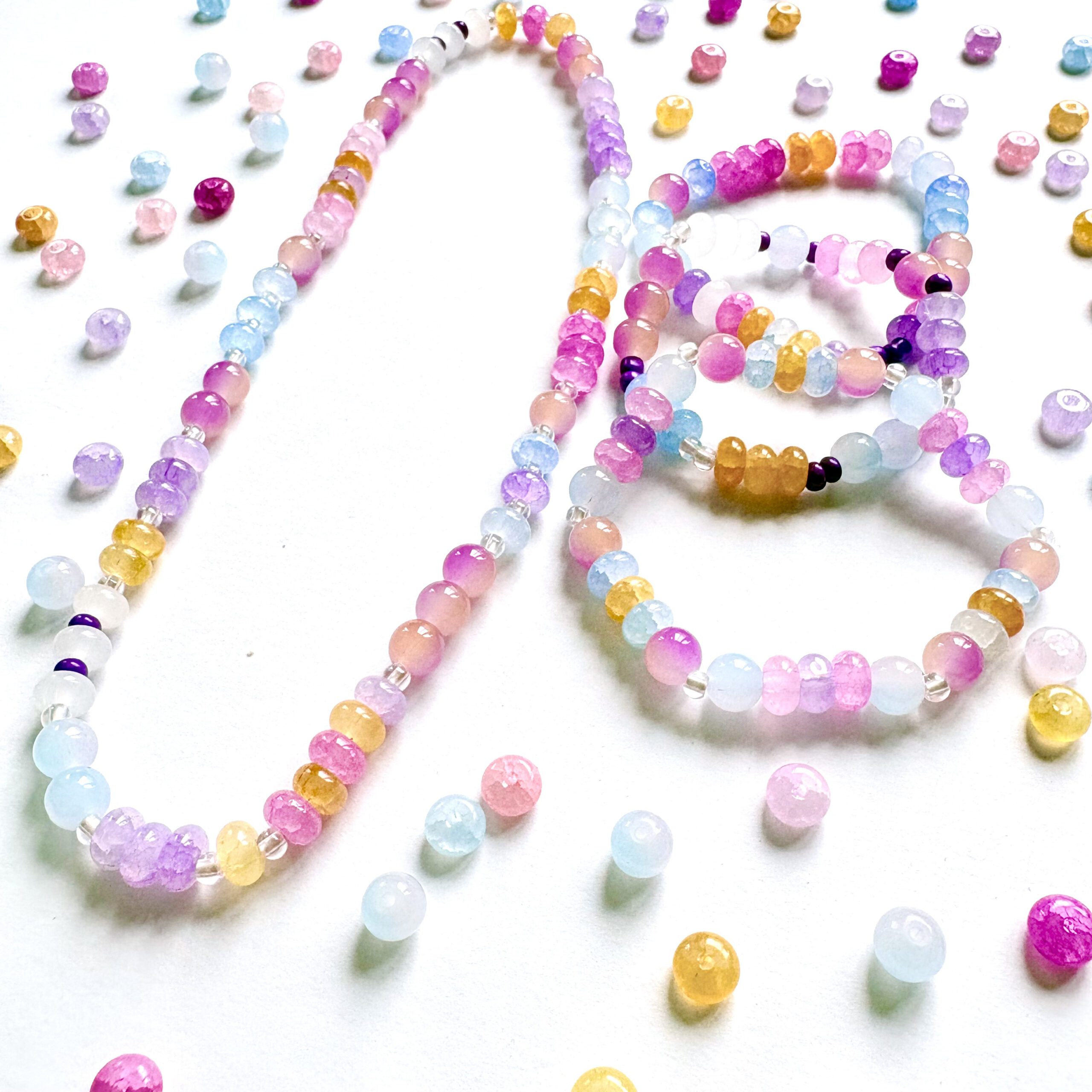 sunset jewellery making set sunset jewellery making set. 1 necklace and 3 bracelets in pink, purple and yellow colours