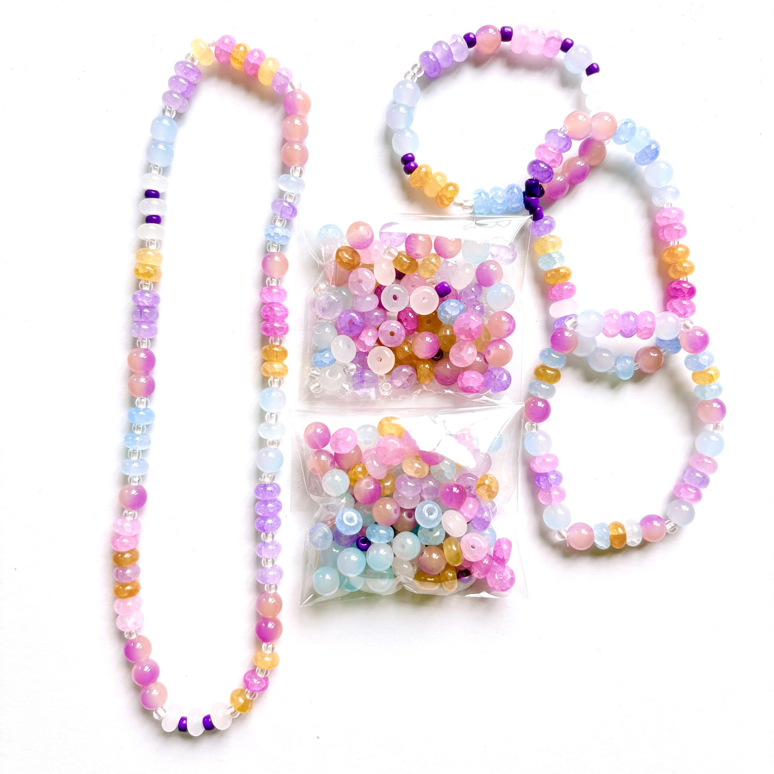 sunset jewellery making set sunset jewellery making set. 1 necklace and 3 bracelets in pink, purple and yellow colours
