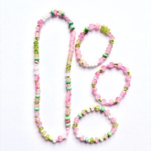 apple crisp jewellery making set. 1 necklace and 3 bracelets in pink and green colours