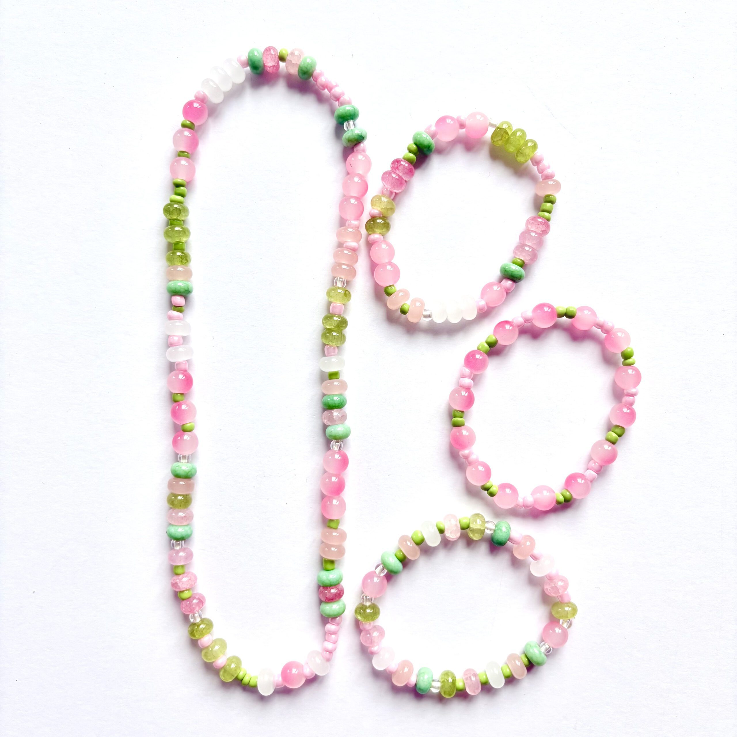 apple crisp jewellery making set apple crisp jewellery making set. 1 necklace and 3 bracelets in pink and green colours