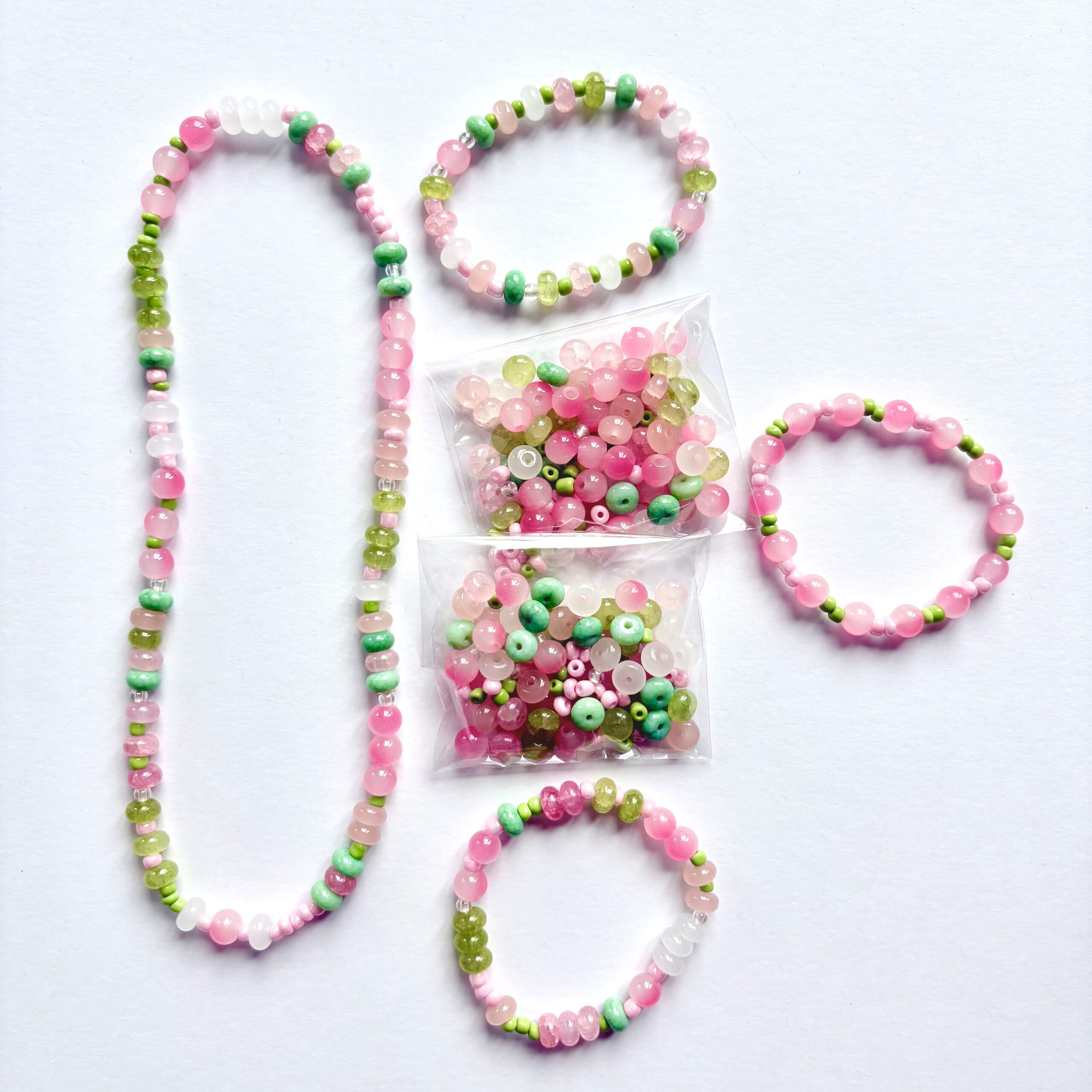 apple crisp jewellery making set apple crisp jewellery making set. 1 necklace and 3 bracelets in pink and green colours