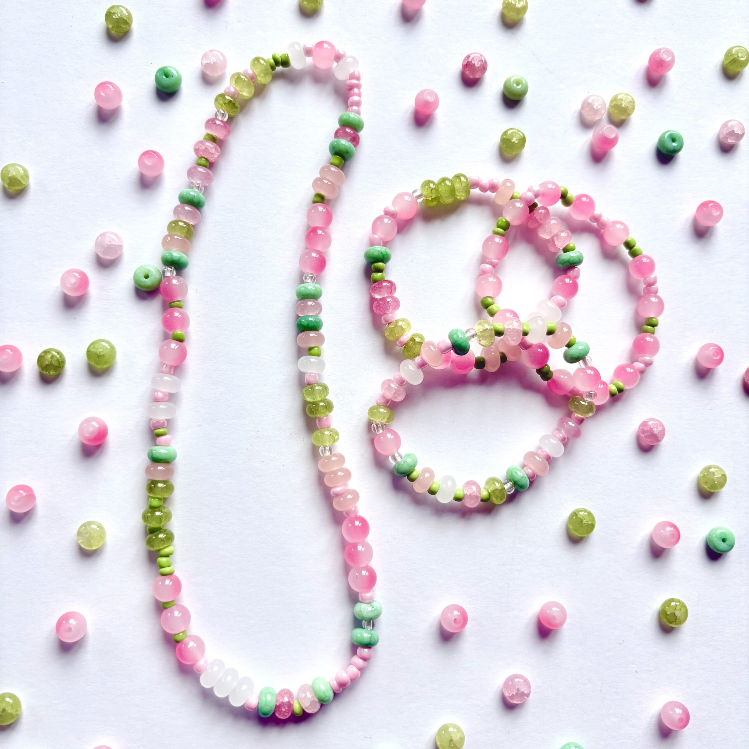 apple crisp jewellery making set apple crisp jewellery making set. 1 necklace and 3 bracelets in pink and green colours